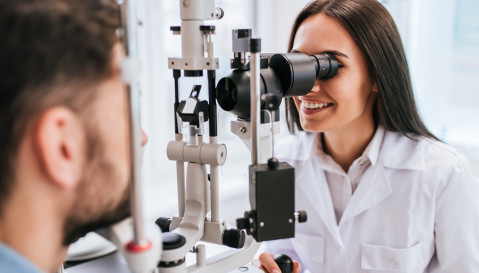 Ophthalmologist doing eye measurements
