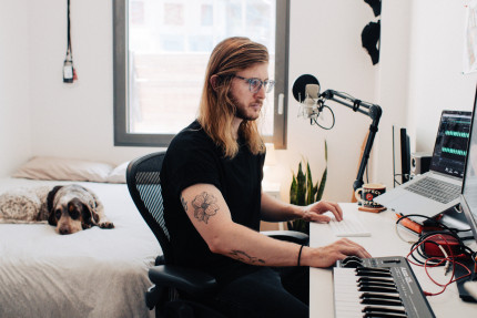 Lance Johnson behind his desk, podcasting