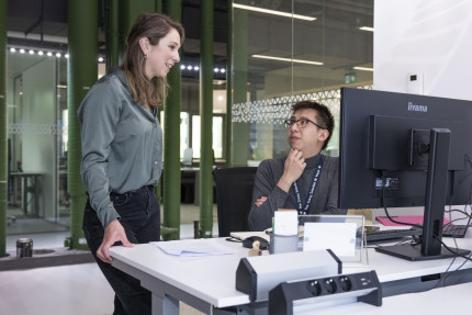 ProQRians discussing work in the office