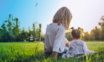 Girl and Mother sitting in a park