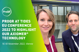 Two ProQRians standing outside TIDES EU 2022 Conference Entrance